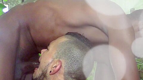 A big black African cock fucks a sexy tattooed Latino guy in the countryside  - Big Bamboo Salvage
