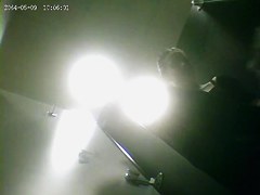 A fit milf is getting dresed in a sport club changing room