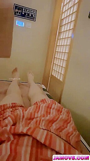 An Asian woman is seen urinating on in a public washroom