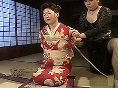 An older hottie in a kimono getting into hardcore bondage