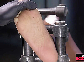 BDSM sub ebony suffers feet torment in predicament bondage