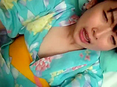 Beautiful cute girl wearing a yukata dress to sell at the hotel 