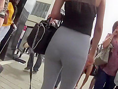 Black thong peeks thru grey leggings