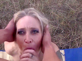 Blonde mature sucks & fucks outdoors