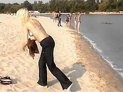 Blonde nudist girl at a beach