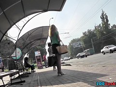 Blonde waits for a bus in the upskirt outdoor scene