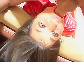 Brunette in red PVC gloves and boots gives blowjob