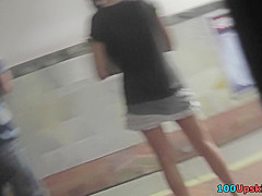 Brunette's athletic ass in jeans skirt in upskirt mov