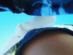 Candid street upskirt of a blonde in a jean skirt and blue panties