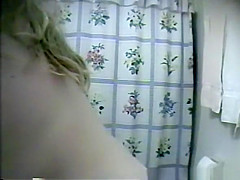 Chubby blonde taking off her clothes