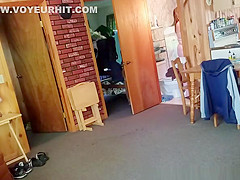 Chubby wife combing her hair in bathroom