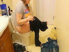 Chubby woman caught peeing in bathroom toilet