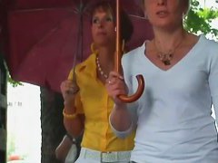 Classy blonde in heels and white pants in a street candid vid