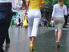 Classy blonde in heels and white pants in a street candid vid