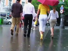 Classy blonde in heels and white pants in a street candid vid
