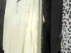 Curvy woman in a short skirt goes shopping
