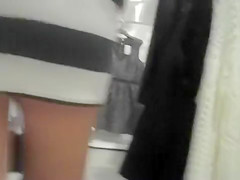 Curvy woman in a short skirt goes shopping