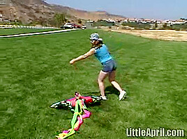 Cute Little April Outdoors Sucking A Popsicle