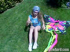 Cute Little April Outdoors Sucking A Popsicle