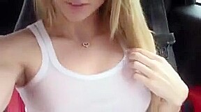 Delicious blonde girl masturbating in the car
