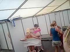Dozens of actresses shower in tented locker area