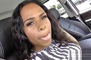 Ebony shemale with fake boobs is playing with her cock and fucks her own ass with a toy
