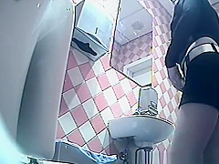 Girl in shorts pees in toilet