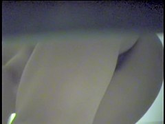 Girl leans forward and shakes tits into