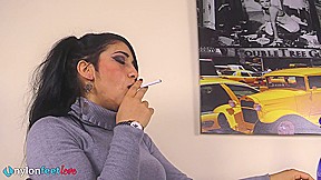 Gorgeous Sharon smoking a cigarette and showing off her nyloned feet