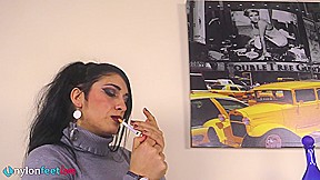 Gorgeous Sharon smoking a cigarette and showing off her nyloned feet