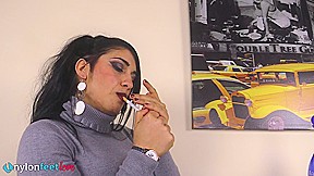 Gorgeous Sharon smoking a cigarette and showing off her nyloned feet