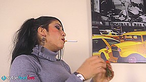 Gorgeous Sharon smoking a cigarette and showing off her nyloned feet