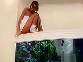 Hairy brunette masturbating for a music