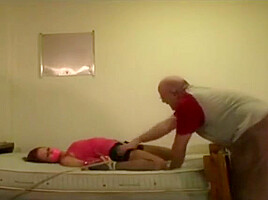 Helpless tied on bed