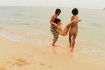 Hot and sexy brunette Asian babe gagging hard cocks and double penetrated on the beach