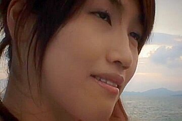 Hot and sexy brunette Asian babe gagging hard cocks and double penetrated on the beach