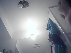 Hot blonde undresses and showers