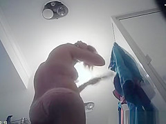 Hot blonde undresses and showers