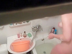 Hot woman washes in the bathtub