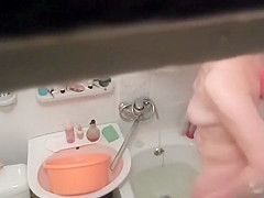 Hot woman washes in the bathtub