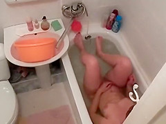 Hot woman washes in the bathtub