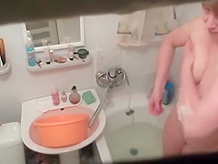 Hot woman washes in the bathtub