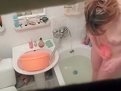 Hot woman washes in the bathtub