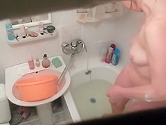 Hot woman washes in the bathtub