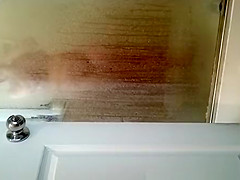 Husband films wife in shower
