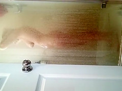 Husband films wife in shower