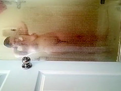 Husband films wife in shower