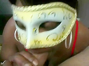 Masked ebony chick sucks giving head