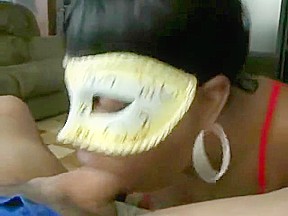 Masked ebony chick sucks giving head