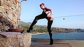 Mature British redhead masturbating on the balcony